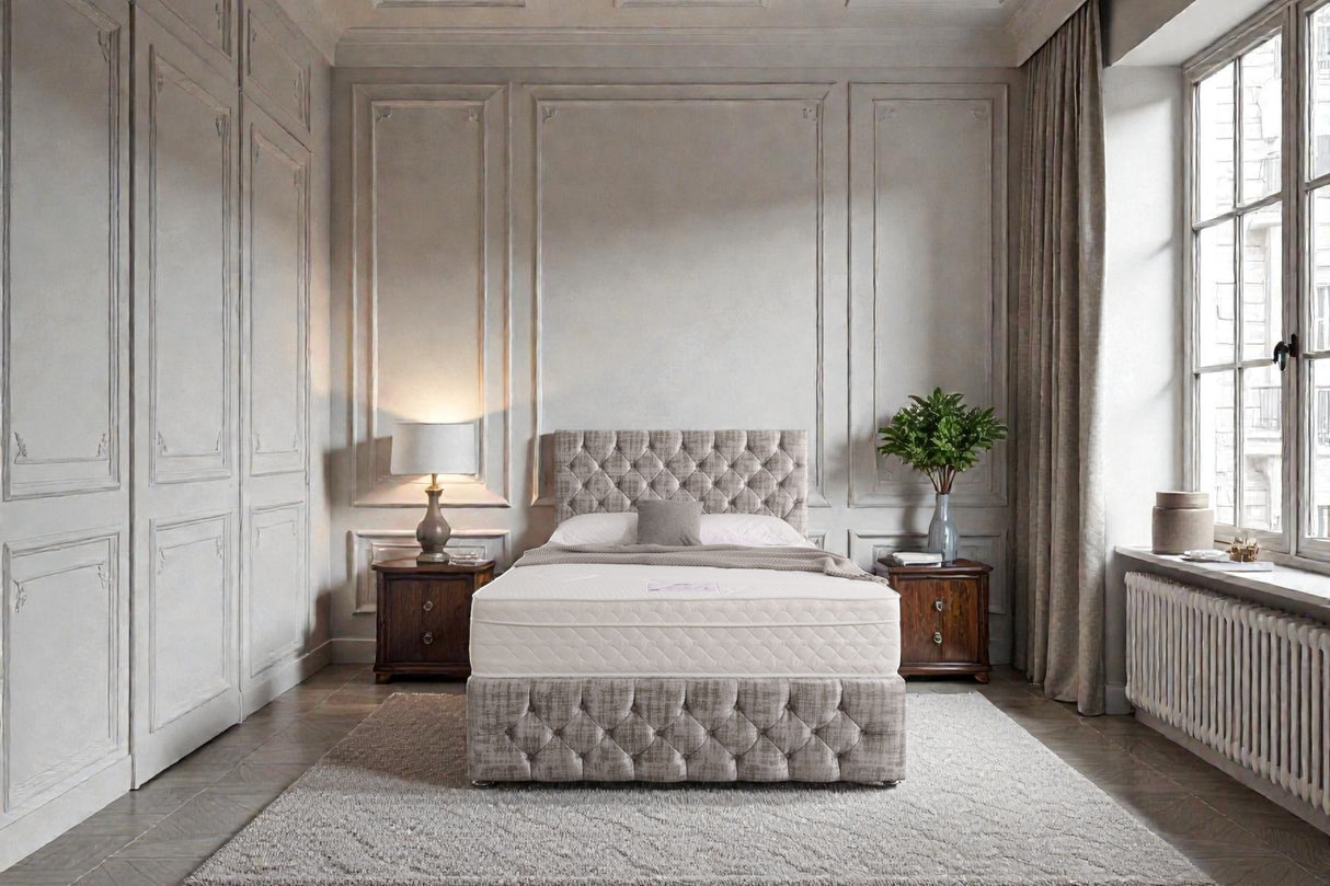 Divan bed set with tall button-tufted headboard and matching footboard in a modern bedroom setting.