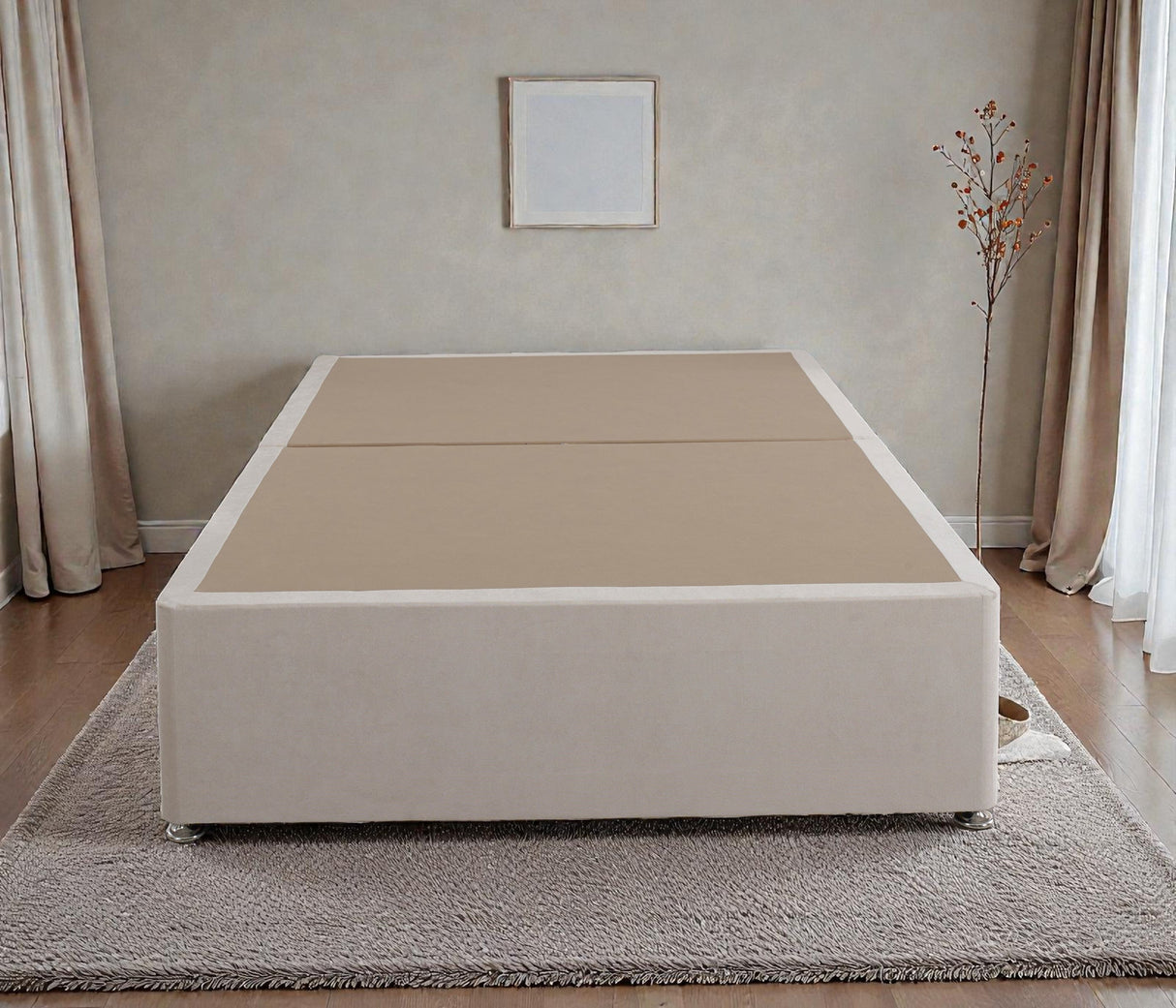 Platform top divan bed base in neutral fabric with a sturdy rectangular shape and storage drawers at the sides.