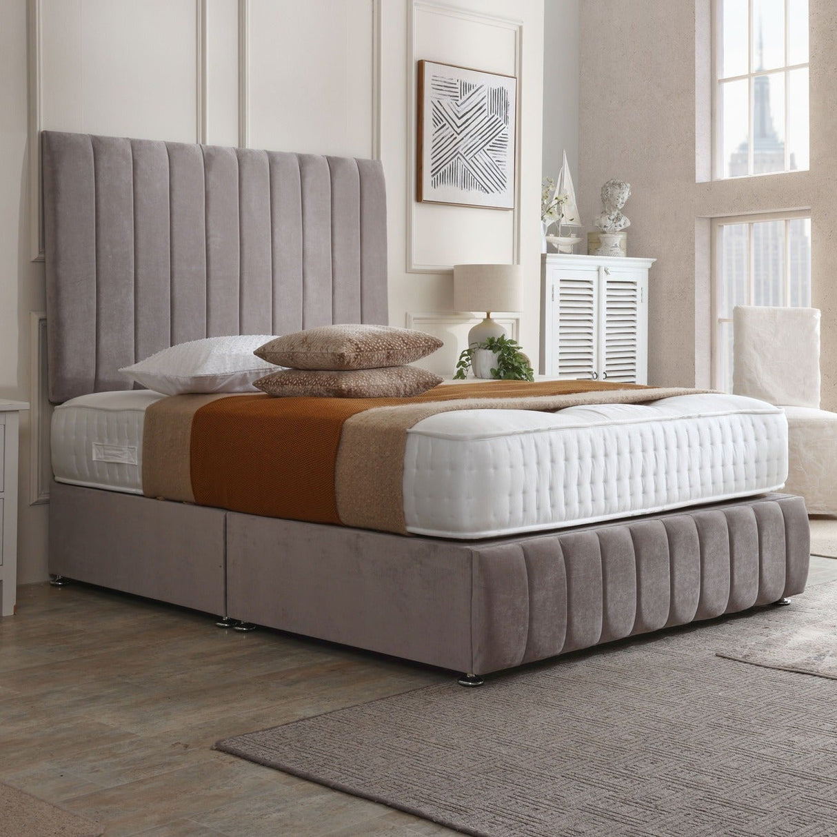 Maya divan bed set with tall headboard and footboard, featuring a sleek fabric finish and modern design for bedroom decor