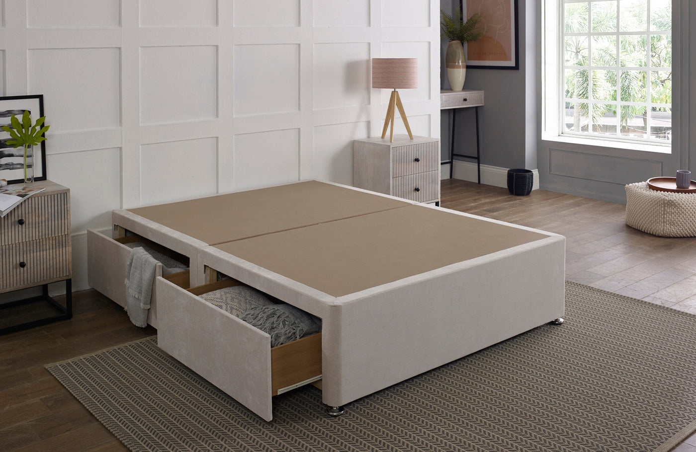 Standard platform top divan bed base in a neutral fabric, providing sturdy support and a sleek look for a modern bedroom.