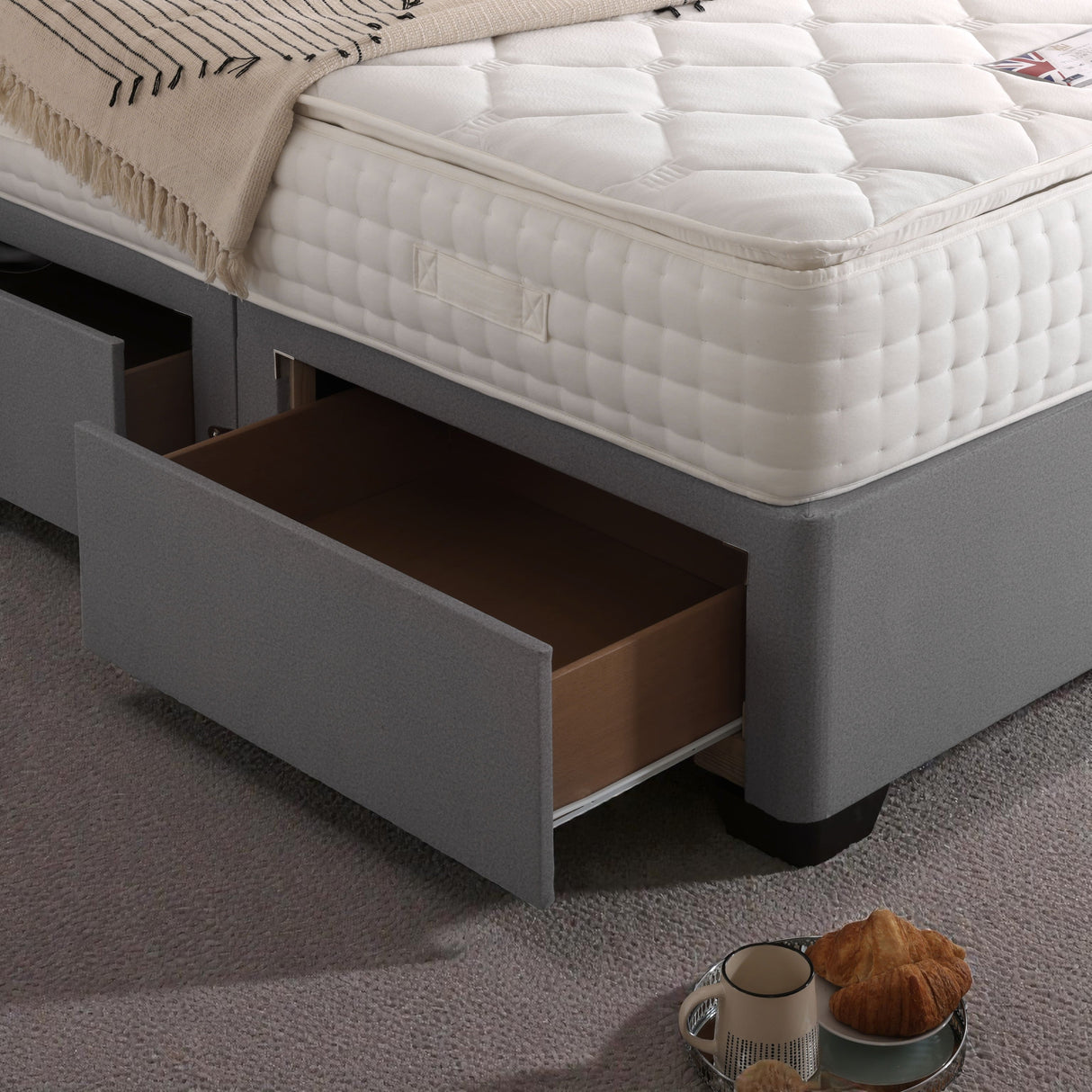 Madrid divan bed set with button-tufted headboard, featuring a sleek, modern design and plush fabric for a stylish bedroom look.