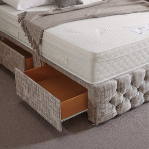 Divan bed set with tall button-tufted headboard and matching footboard, featuring a sleek design for modern bedrooms.