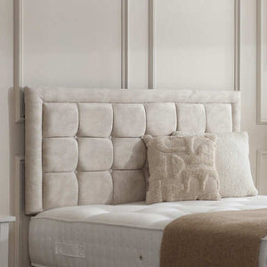 Chelsea divan bed set with button-bordered headboard, featuring a fabric upholstery and modern design for a stylish bedroom.