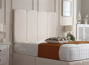 Kylie divan bed set with tall button-tufted headboard and footboard, featuring a modern design in a bedroom setting.