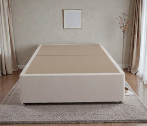 Platform top divan bed base in neutral fabric with a sturdy rectangular shape and storage drawers at the sides.