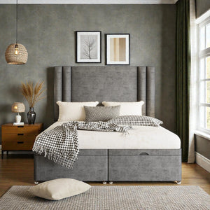 Elena Ottoman Divan Bed Set with fabric upholstery and storage drawers, shown in a modern bedroom setting.