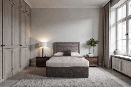 Sofia divan bed set with border headboard in a modern bedroom, featuring a plush fabric upholstery and clean design.