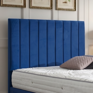 Maya divan bed set with tall headboard and footboard, featuring a modern design in a bedroom setting