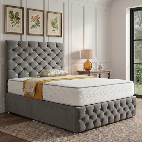 Monarch divan bed set with tall button-tufted headboard and matching footboard, featuring a sleek fabric upholstery.
