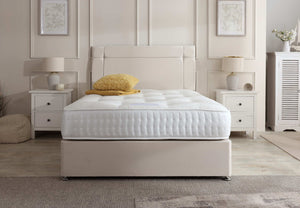 Prague divan bed set with button-tufted headboard in a modern bedroom setting, featuring a sleek design and neutral upholstery.