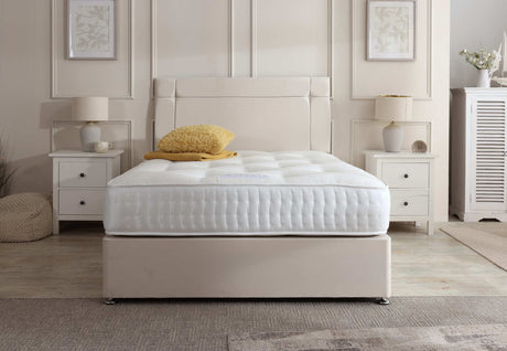 Prague divan bed set with button-tufted headboard and matching base, upholstered in neutral fabric for a modern bedroom look.