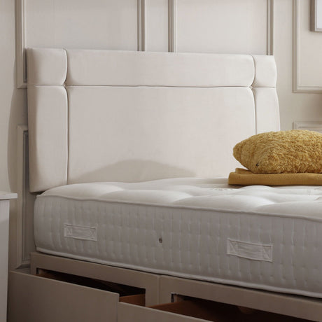 Prague divan bed set with button-tufted headboard, featuring a sleek design and plush upholstery for a comfortable bedroom setup.