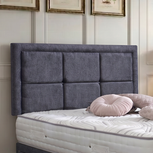Riga divan bed set with a button-bordered headboard in neutral fabric, featuring clean lines and a modern design.