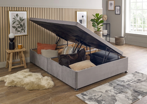 Side lift ottoman storage divan bed base by Mattress Supermarket showing the fabric-covered frame with side lifting mechanism.