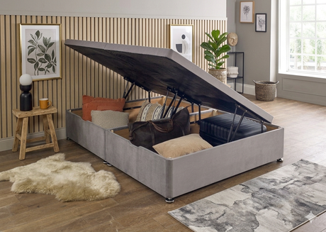 Side lift ottoman storage divan bed base by Mattress Supermarket showing the fabric-covered frame with side lifting mechanism.